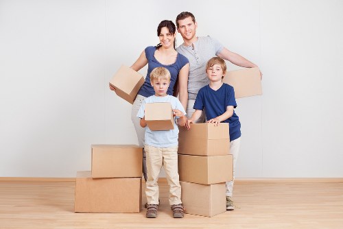 Professional movers coordinating an office relocation inside a Belsize Park commercial property