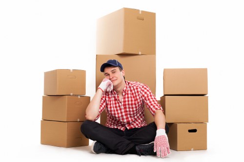 Professional team handling furniture relocation in a narrow Belsize Park street