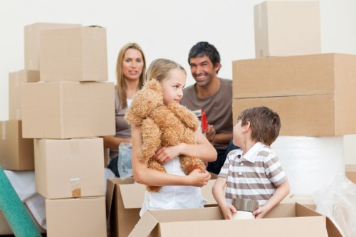 Moving boxes and furniture through a residential building in Belsize Park